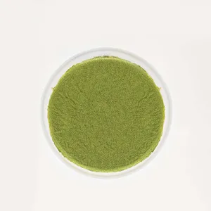 A top-down shot of a Lady M Gluten-Free Green Tea Mille Crêpes on top a white cake stand.