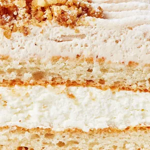 Close up shot of Lady M's Gateau aux Marrons with layers of cake, mousse, cream and nuts.
