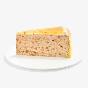 A Lady M Carrot Cake Mille Crêpes slice on top a white round plate.