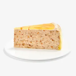 A Lady M Carrot Cake Mille Crêpes slice on top a white round plate.