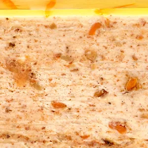 A Lady M Carrot Cake Mille Crêpes detail shot. Layers of crêpe, cream, cake crumble, and jelly.