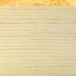 Detail shot of Lady M's Gluten-Free Signature Mille Crêpes. Layers of crêpe, and pastry cream.