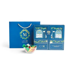 A Lady M 2025 Holiday Crêpe Biscuit Tasting Set with matching Gift Bag.