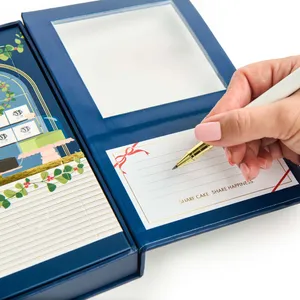 A close up of an open Lady M 2025 Holiday Crêpe Biscuit Tasting Set.