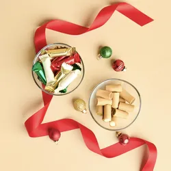 A top down shot of Lady M's Holiday Mini Crêpe Biscuits on a beige background.