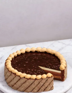 Lady M's Noisettes au Chocolat cake on a marble surface.