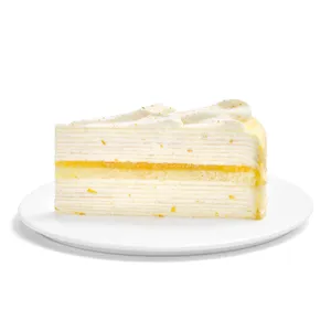A slice of Lady M's Orange Mille Crepes on a white cake plate.