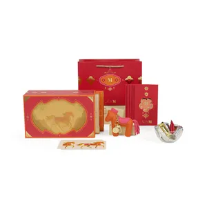 Lady M's 2026 Year of the Horse Gift Set with box, bag charm, envelopes, candies, card, and bag.