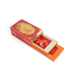 An open Lady M 2026 Year of the Horse Gift Set showing the bag charm