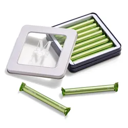 Lady M's Green Tea Crêpe Biscuits in an open tin with two biscuits outside