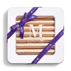 Lady M's Vanilla Crêpe Biscuits with a logo on the top lid and a blue ribbon.
