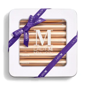 Lady M's Vanilla Crêpe Biscuits with a logo on the top lid and a blue ribbon.