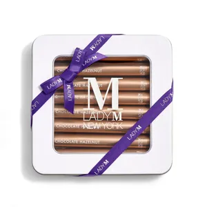 Image of Lady M's Chocolate Hazelnut Crêpe Biscuits with a logo on the top lid and a blue ribbon.