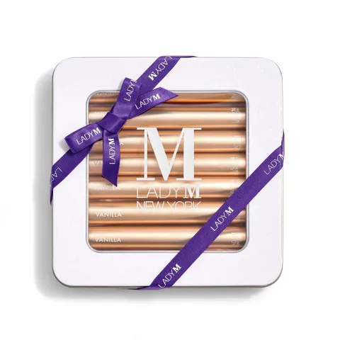 Lady M's Vanilla Crêpe Biscuits with a logo on the top lid and a blue ribbon.