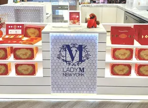 Lady M kiosk pop-up at Jewel Changi Airport Singapore with illuminated display shelves
