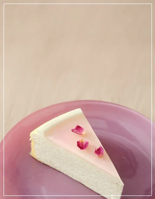 Mother’s Day Collection: A slice of Rose Mille Crepe decorated with dried rose petals on a lavender plate.