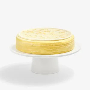 Whole Osmanthus Mille Crêpes cake featuring delicate floral glaze and signature handcrafted crêpe layers