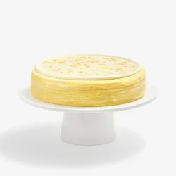Whole Osmanthus Mille Crêpes cake featuring delicate floral glaze and signature handcrafted crêpe layers
