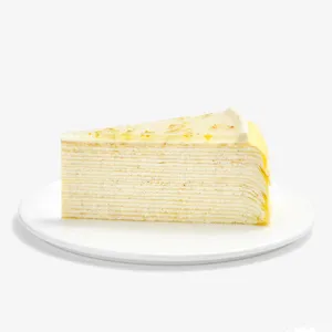Slice of Osmanthus Mille Crêpes showcasing delicate handcrafted layers and glossy floral osmanthus glaze