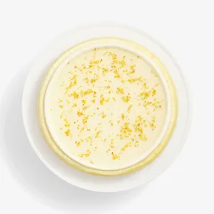 Top-down view of Osmanthus Mille Crêpes with glossy floral glaze and delicate osmanthus blossoms
