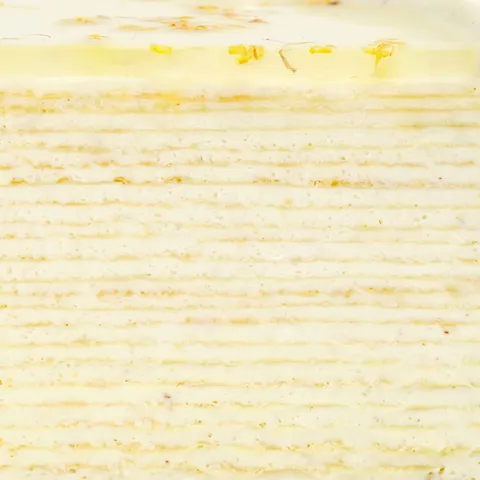 Close-up of Osmanthus Mille Crêpes layers with delicate cream filling and handcrafted crêpe texture