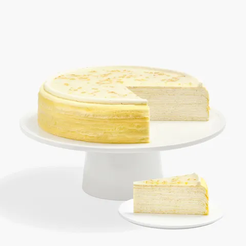 Osmanthus Mille Crêpes whole cake and slice showcasing delicate floral layers and glossy glaze finish