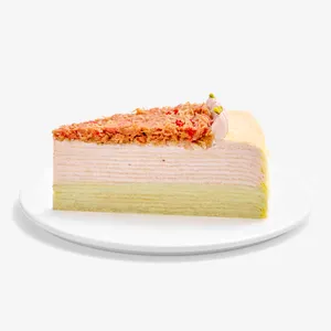 Slice of Dubai Strawberry Mille Crêpes on a small white plate.