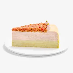Slice of Dubai Strawberry Mille Crêpes on a small white plate.