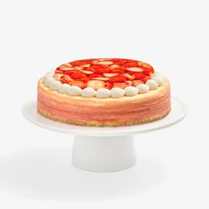 Whole strawberry mille crêpes cake with cream border, front view on white stand