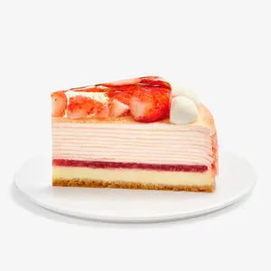 Single slice of strawberry mille crêpes cake on white plate, side view
