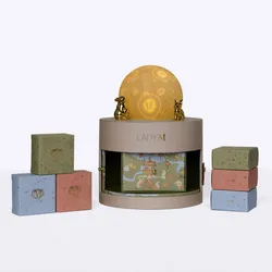 Lady M Moonlit Reverie set with mooncake box open, surrounded by three mini boxes