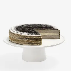 Whole Sesame Mochi Mille Crêpes cake on white stand, one slice removed showing mochi center layer