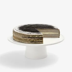 Sesame Mochi Mille Crêpes cake with slice removed, revealing layered crêpe cross-section