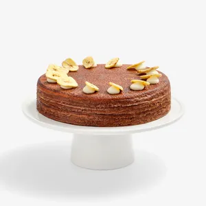 Whole Chocolate Banana Mille Crêpes cake topped with banana chip garnish, front view