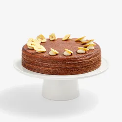 Whole Chocolate Banana Mille Crêpes cake topped with banana chip garnish, front view