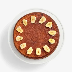 Overhead view of Chocolate Banana Mille Crêpes topped with banana chips in a circle