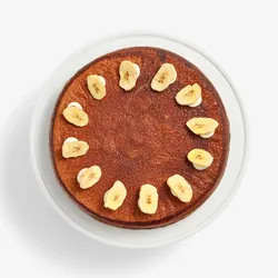 Overhead view of Chocolate Banana Mille Crêpes topped with banana chips in a circle