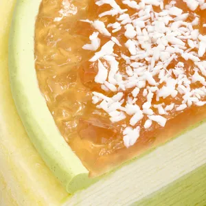 Close-up of jam and shredded coconut topping on Coconut Matcha Mille Crêpes