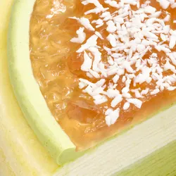 Close-up of jam and shredded coconut topping on Coconut Matcha Mille Crêpes