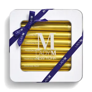 Lady M Passion Fruit Crêpe Biscuit tin tied with a navy ribbon