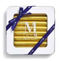 Lady M Passion Fruit Crêpe Biscuit tin tied with a navy ribbon