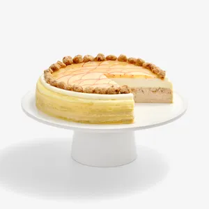 Apple Pie Mille Crêpes with a slice cut away, showing vanilla and spiced apple cream layers