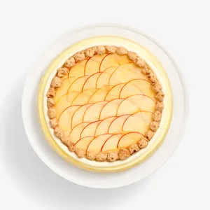 Top view of Apple Pie Mille Crêpes with fanned apple slices ringed by crumble clusters