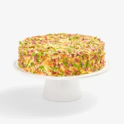 Whole Lady M Birthday Cake 9" covered in colorful crêpefetti on a white cake stand